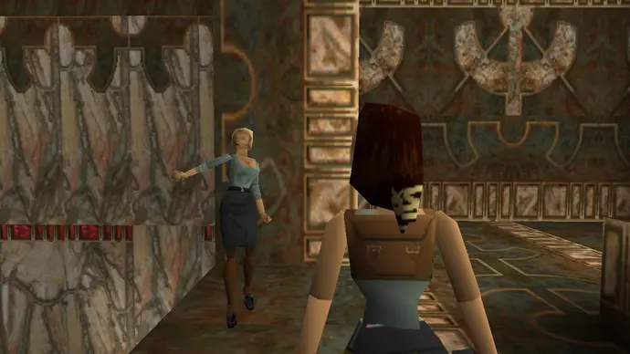 Natla approaches Lara in Tomb Raider (1996).